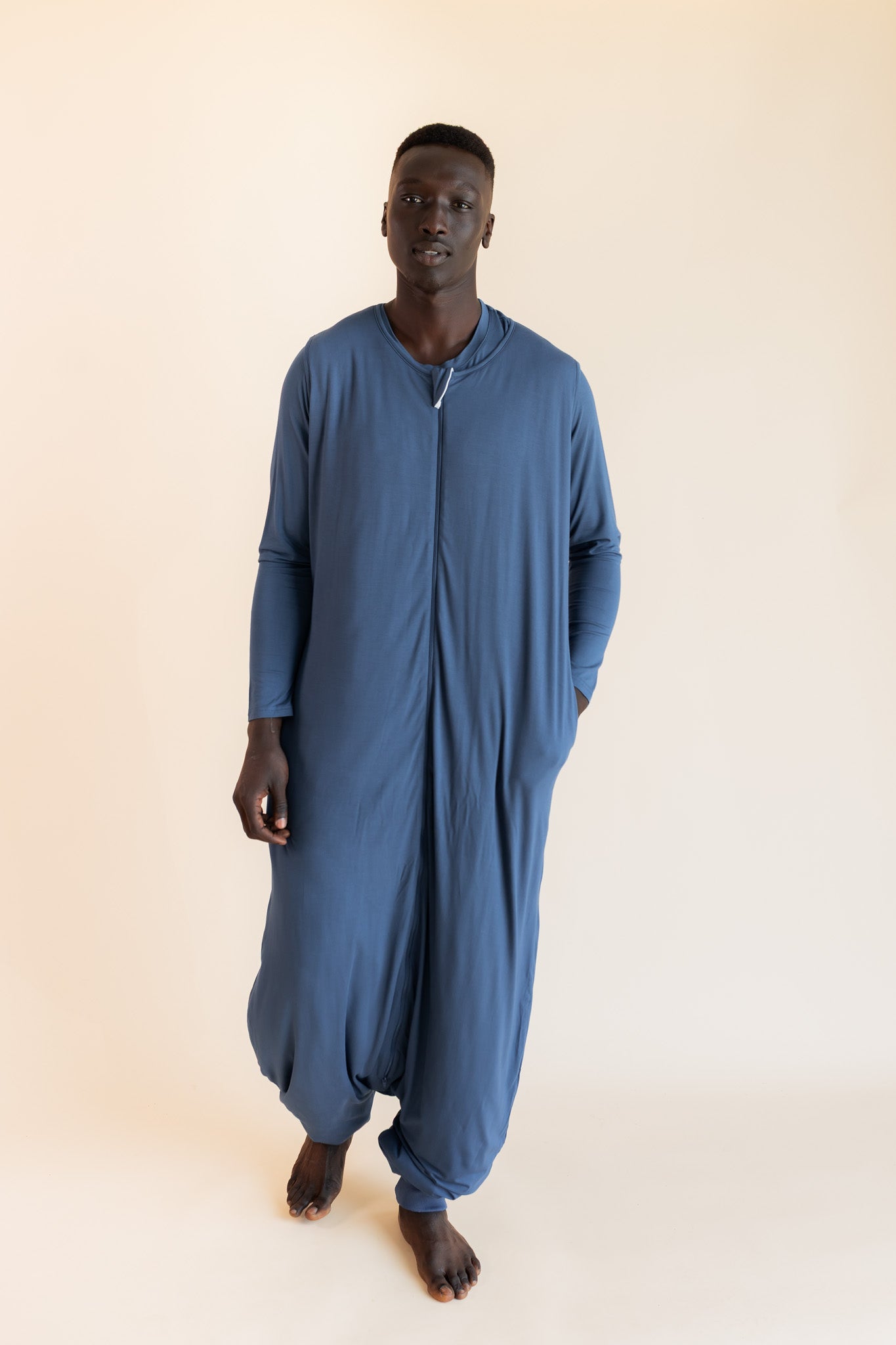 Model wearing Adult Sleep Sack in Oxford on a beige background