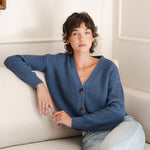 Woman sitting on the couch with her arm propped up in a cropped cardigan in oxford
::: Model is 5'10" wearing size XS ///