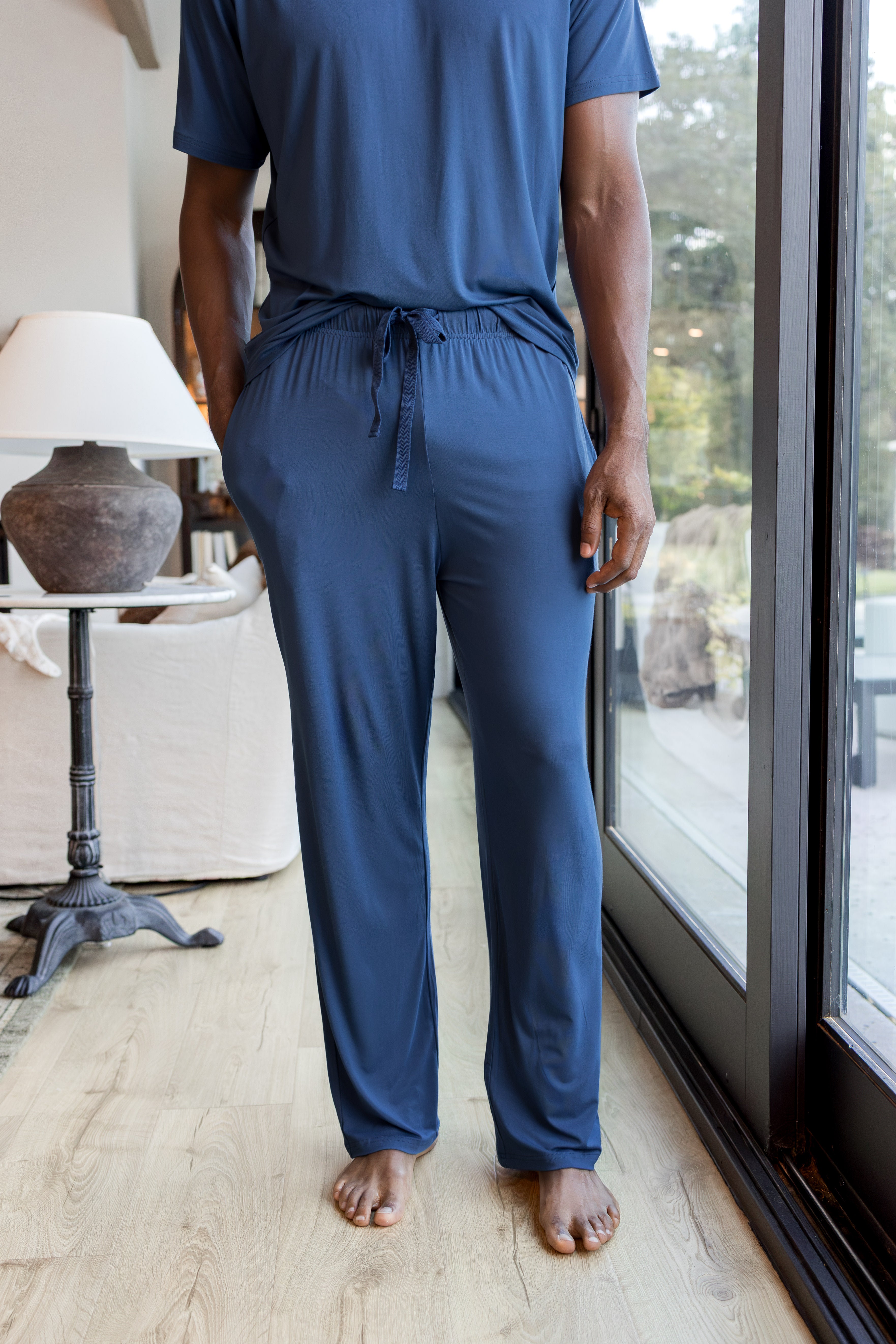 Model wearing Men's Lounge Pants in Oxford under Men's crew neck tee 
::: Model is 6'2" wearing size L ///