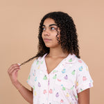 Model looking to the side and close up of the top from the Short Sleeve Pajama Set in Pastel Ghost 