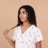 Model looking to the side and close up of the top from the Short Sleeve Pajama Set in Pastel Ghost 