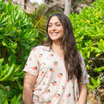 Model wearing the Women’s Relaxed Fit V-Neck in Peach paired with jean shorts