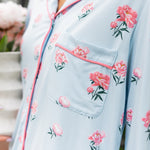 Side of a woman's front in a long sleeve pajama top in Peony on Breeze print. ---PJ 2