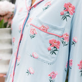 Side of a woman's front in a long sleeve pajama top in Peony on Breeze print. ---PJ 2