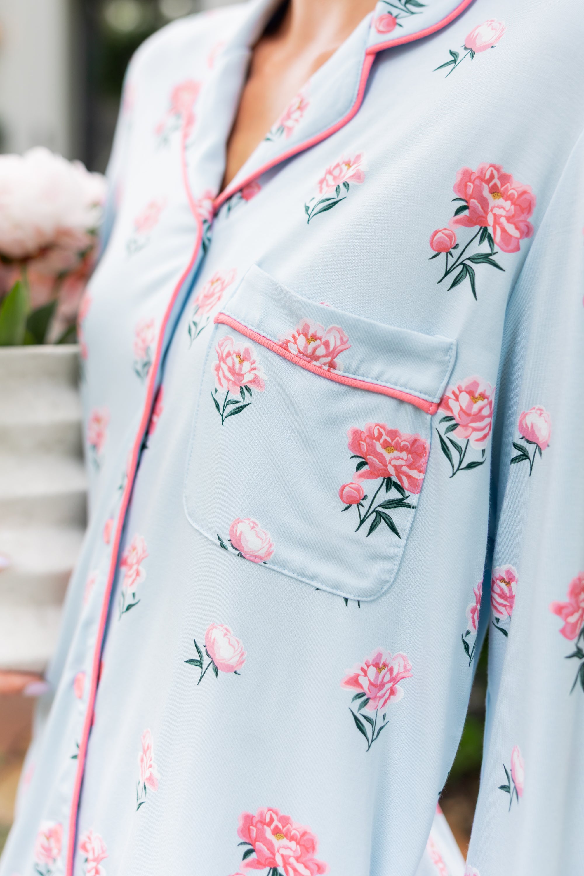 Side of a woman's front in a long sleeve pajama top in Peony on Breeze print. ---PJ 2
