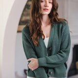 Woman with one arm holding the other in a cardigan in pine color
::: Model is 5'8" wearing size XS ///
