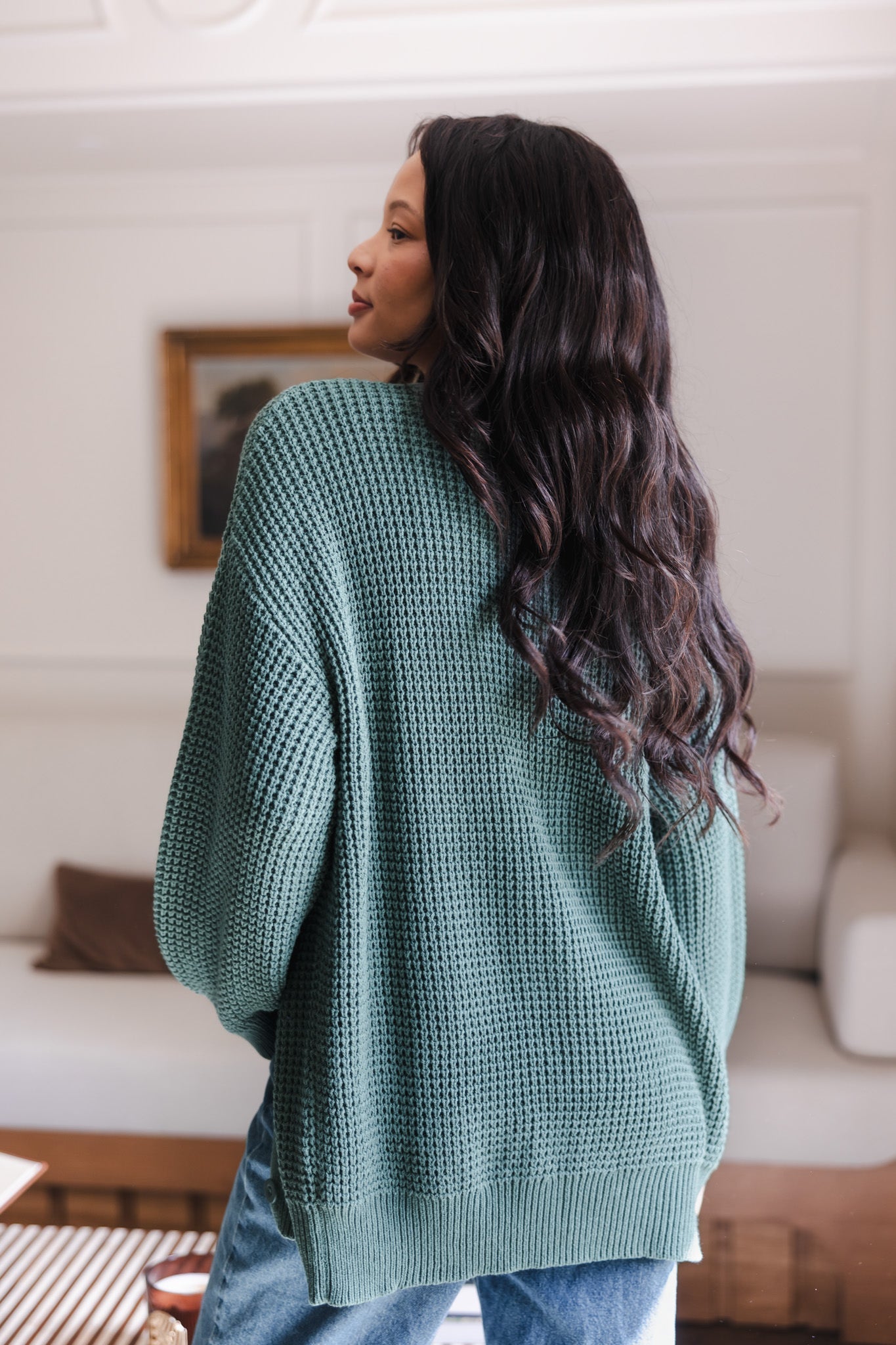 Modal showcasing the backside of Chunky Knit Women's Waffle Cardigan in Pine over blue jeans