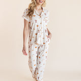 Model posing in Women's Short Sleeve Cropped Pajama Set in Pumpkin Spice Latte print on a beige background
---PJ 4