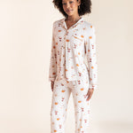 Model wearing Long-Sleeved Women's Pajama Set in Pumpkin Spice Latte print on a beige background
::: Model is 5'9"" wearing size S ///