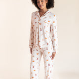 Model wearing Long-Sleeved Women's Pajama Set in Pumpkin Spice Latte print on a beige background
::: Model is 5'9"" wearing size S ///