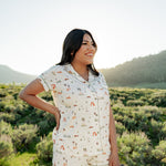 Woman modeling Women's Short Sleeve Pajama Set in Road Trip in Yellowstone National Park with hand on her hip