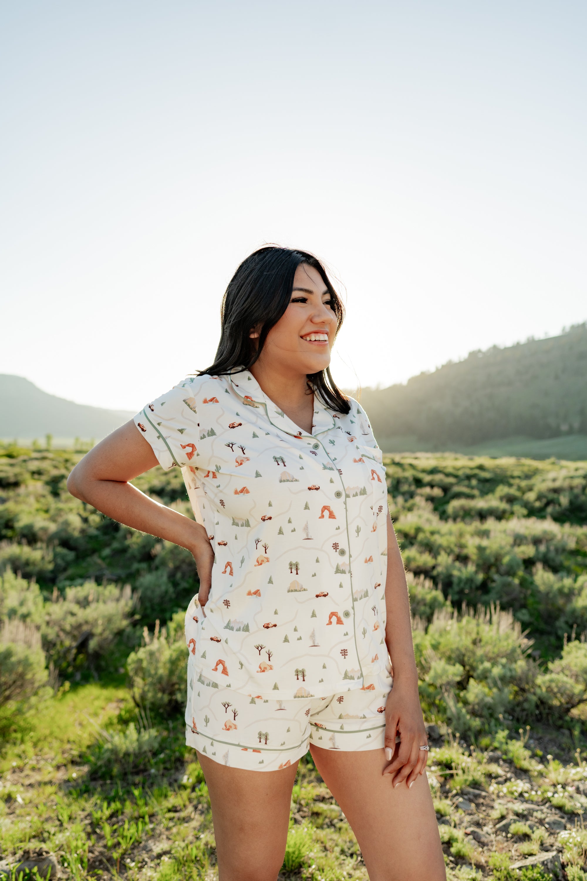Woman modeling Women's Short Sleeve Pajama Set in Road Trip in Yellowstone National Park with hand on her hip