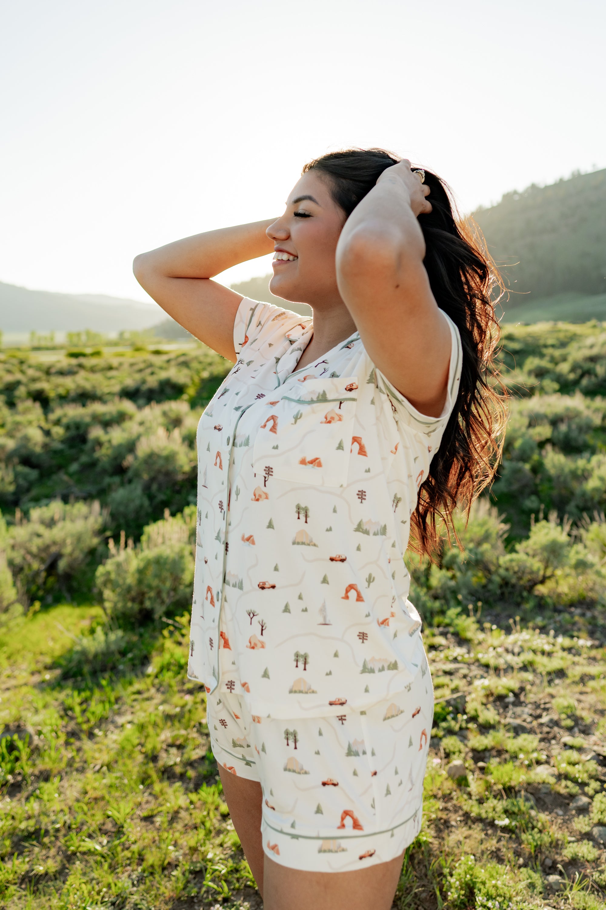 Woman holding up her hair wearing Women's Short Sleeve Pajama Set in Road Trip in Yellowstone National Park