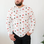 Male model looking to the side while wearing the Kyte Men's Long Sleeve Henley Top in Santa Sleigh