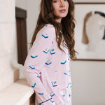 Modal wearing Long-Sleeved Women's Pajama Set in Sakura Mahjong print standing in a room