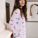 Modal wearing Long-Sleeved Women's Pajama Set in Sakura Mahjong print standing in a room