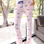 Close up of the Women's Lounge Pants in Sakura Mahjong on a model while she leans on a large window 

::: Model is 5'11" wearing size S ///