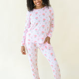 Woman modeling Women's Jogger Pajama Set in Sakura Peony showing there is front pockets