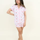 Woman modeling Women's Short Sleeve Pajama Set in Sakura Peony with hand on hip and feet crossed