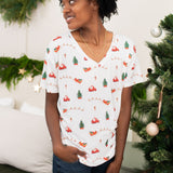 Model looking to the side while wearing the Women's Relaxed Fit V-Neck in Santa Sleigh paired with dark jeans