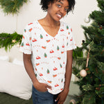 Smiling woman modeling the Kyte Women's Relaxed Fit V-Neck in Santa Sleigh