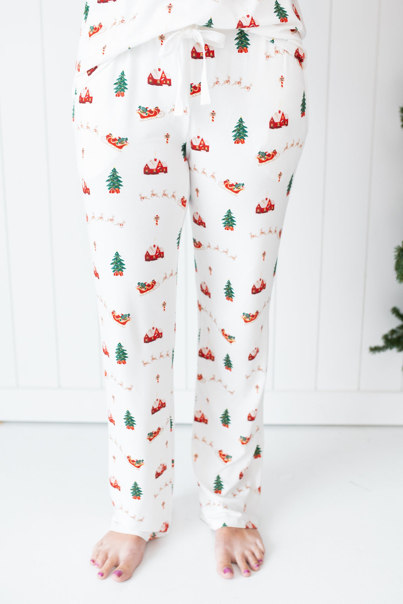 Close up of the Kyte Women's Lounge Pants in Santa Sleigh