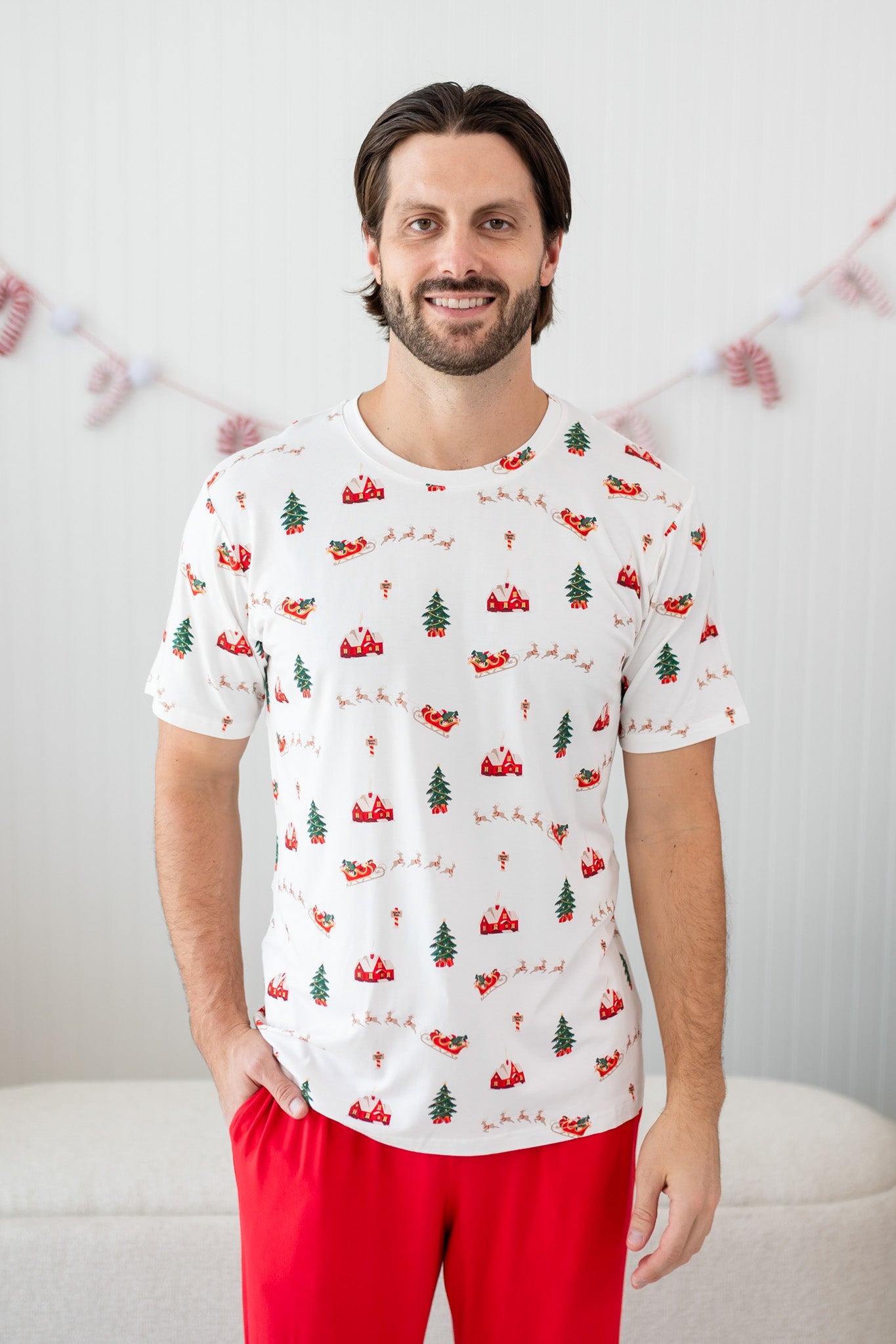 Model wearing the Men's Crew Neck Tee in Santa Sleigh paired with Lounge Pants in Cardinal