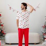 Model wearing the Men's Crew Neck Tee in Santa Sleigh with one arm on his head and Lounge Pants in Cardinal