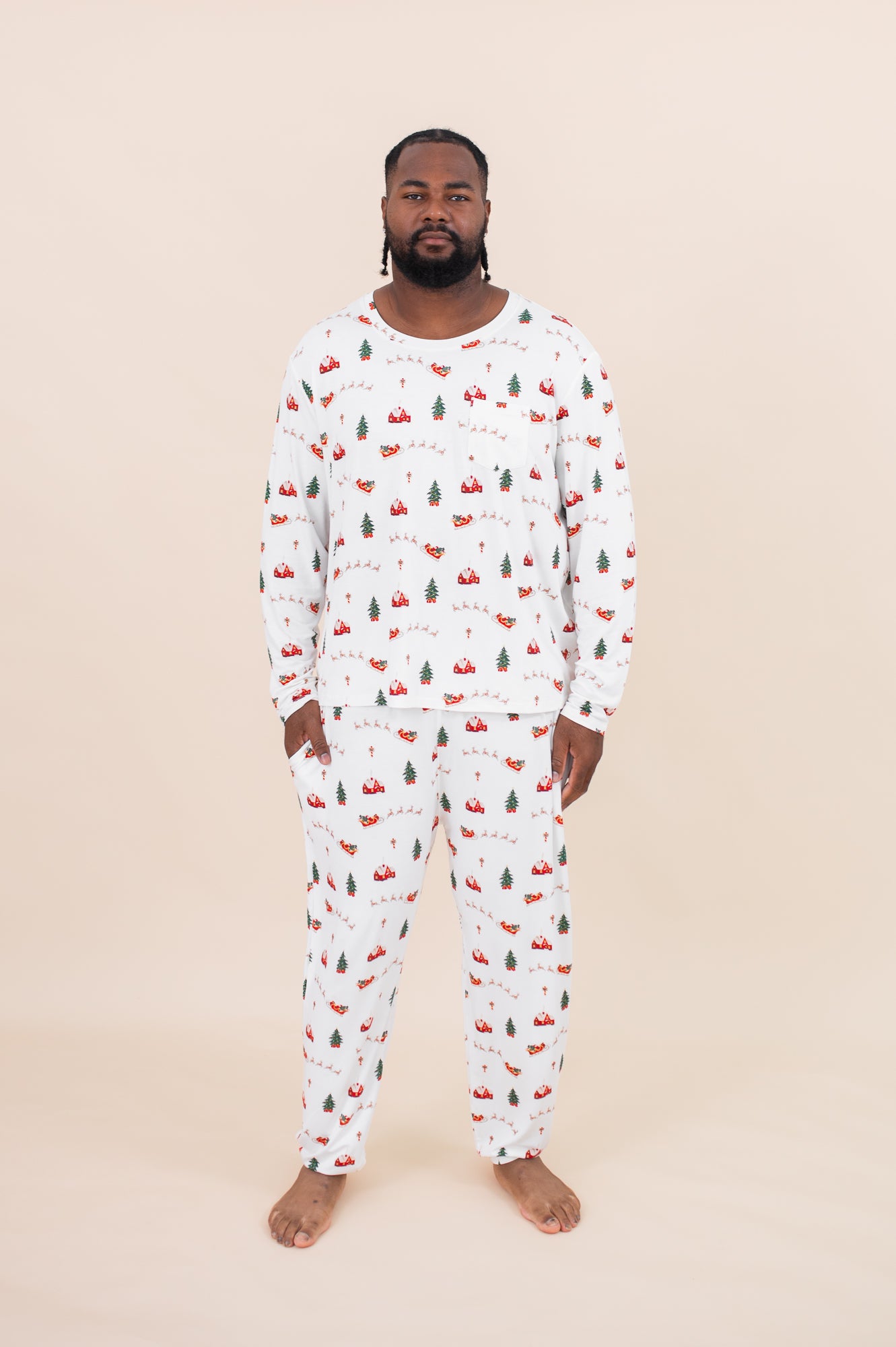 Male model wearing the Kyte Men's Jogger Set in Santa Sleigh