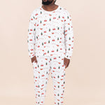 Man standing in front of a beige wall while modeling the Kyte Men's Jogger Set in Santa Sleigh