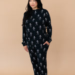 Model looking to the side while wearing the Kyte Women's Jogger Set in Skeleton 