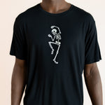 Close up of Modal wearing Black Men's Crew Neck Tee with Skeleton print in center on a beige background