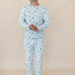 Male model standing wearing the Men's Jogger Set in Ski in front of a light beige background