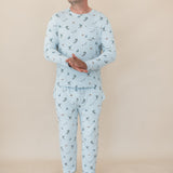 Male model standing wearing the Men's Jogger Set in Ski in front of a light beige background