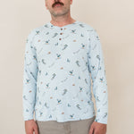 Close up of male modeling the Men's Long Sleeve Henley Top in Ski