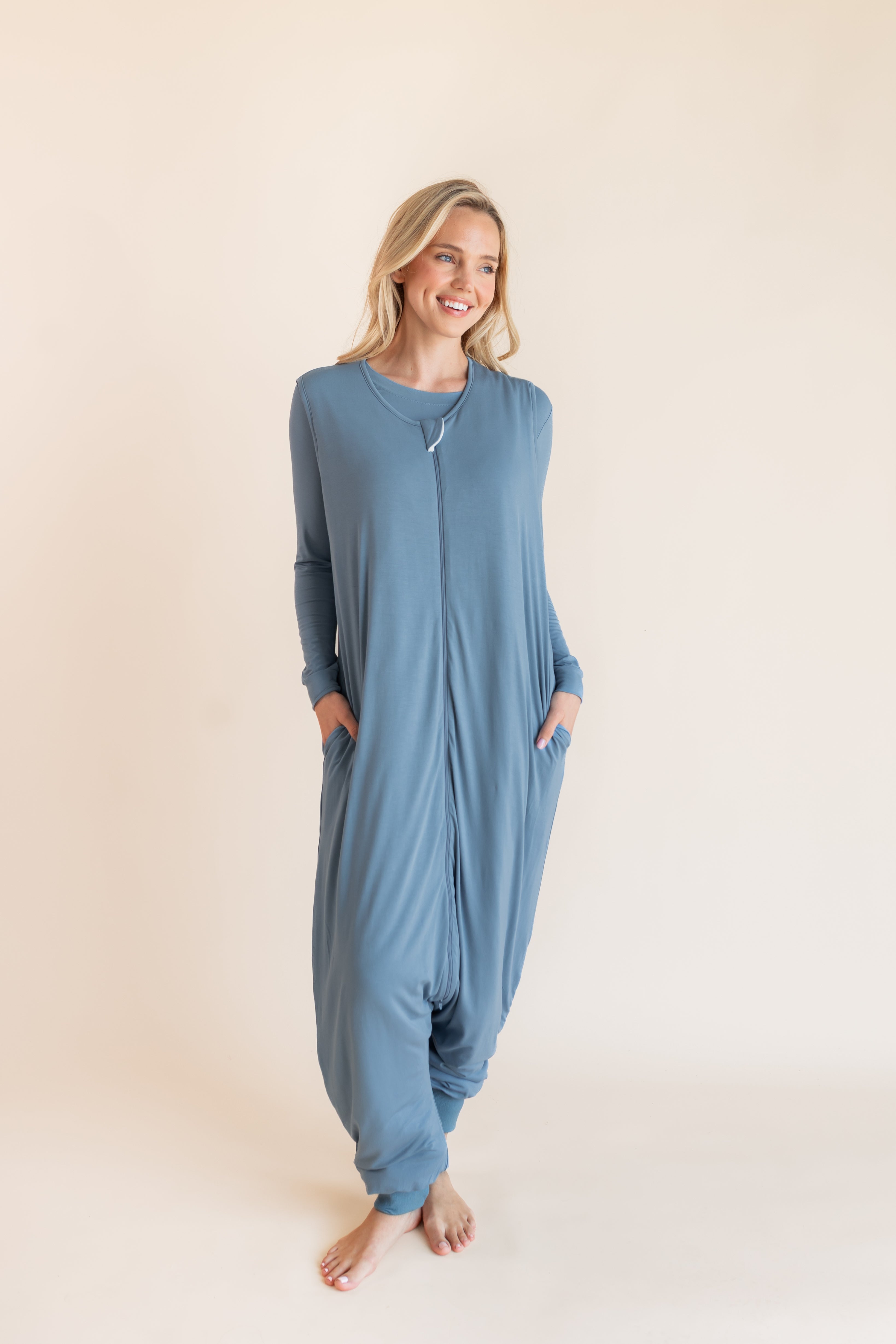 Model wearing a blue sleeveless adult sleep sack that has pockets with matching PJ underneath ::: Model is 5'9" wearing size S/M ///