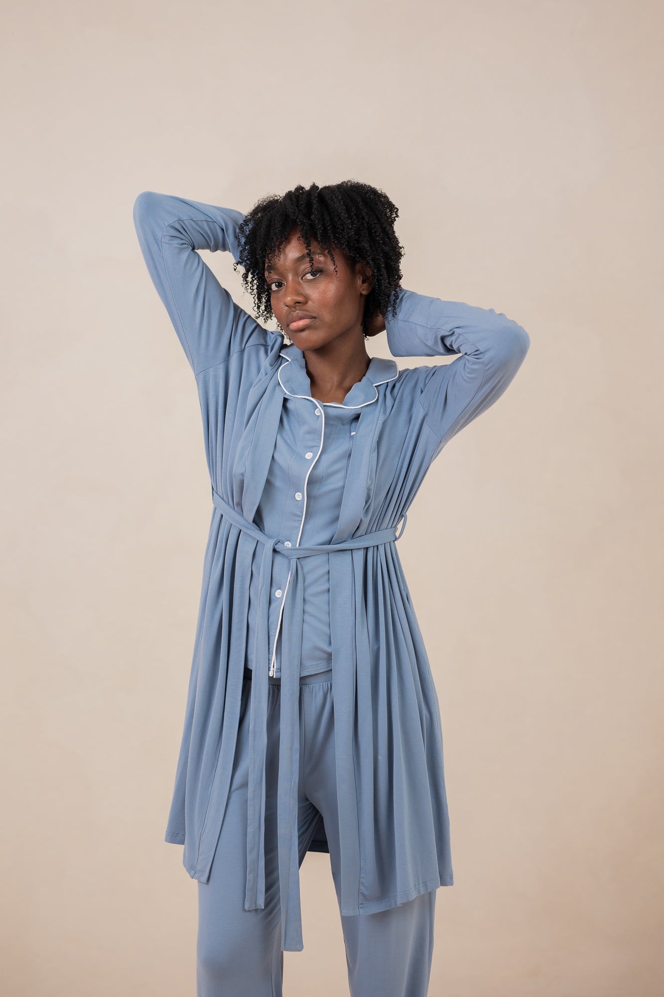 Women modeling the  Kyte Women's Robe in Slate and matching Long Sleeve Pajama Set