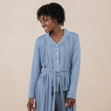 Model smiling to the side while wearing the Women's Robe in Slate and matching Long Sleeve Pajama Set underneath