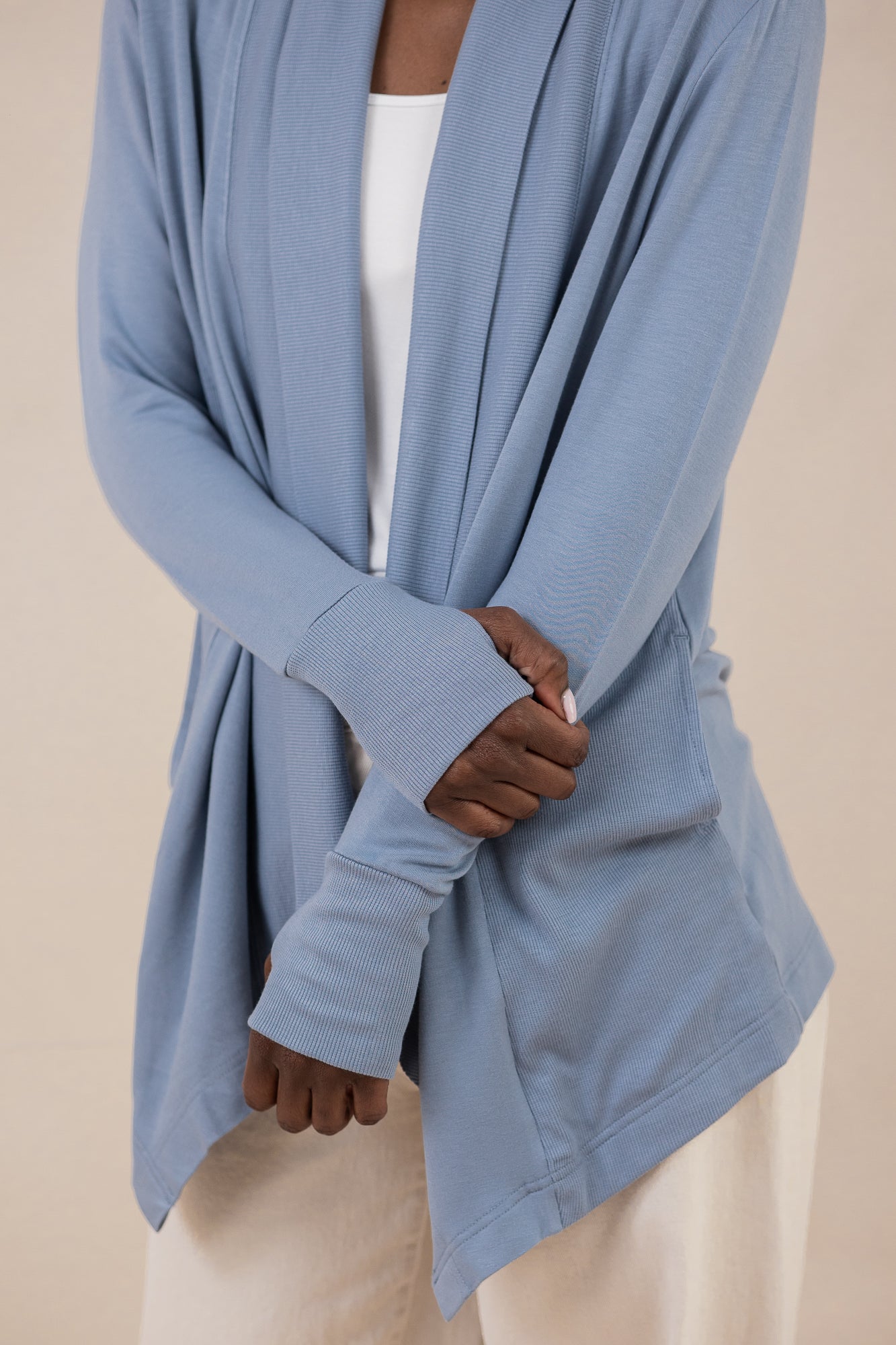 Close up of the rib knit cuffs with the thumbholes on the Women's French Terry Wrap Top in Slate
