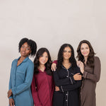 Group of women modeling the Kyte Sleep Shirt in Atlantic, Burgundy, Midnight and Espresso 