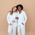 Two female models standing side by side with their arms linked wearing the Long-Sleeved Women's Pajama Set in Big Mist Stripe and Small Mist Stripe