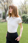 Model looking to the side while wearing the Bamboo Flex Baby Tee in Cloud

::: Model is 5'6" wearing size XS ///