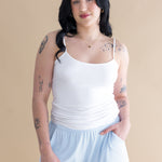 Woman wearing white tank and blue lounge shorts ::: Model is 5'6" wearing size M ///