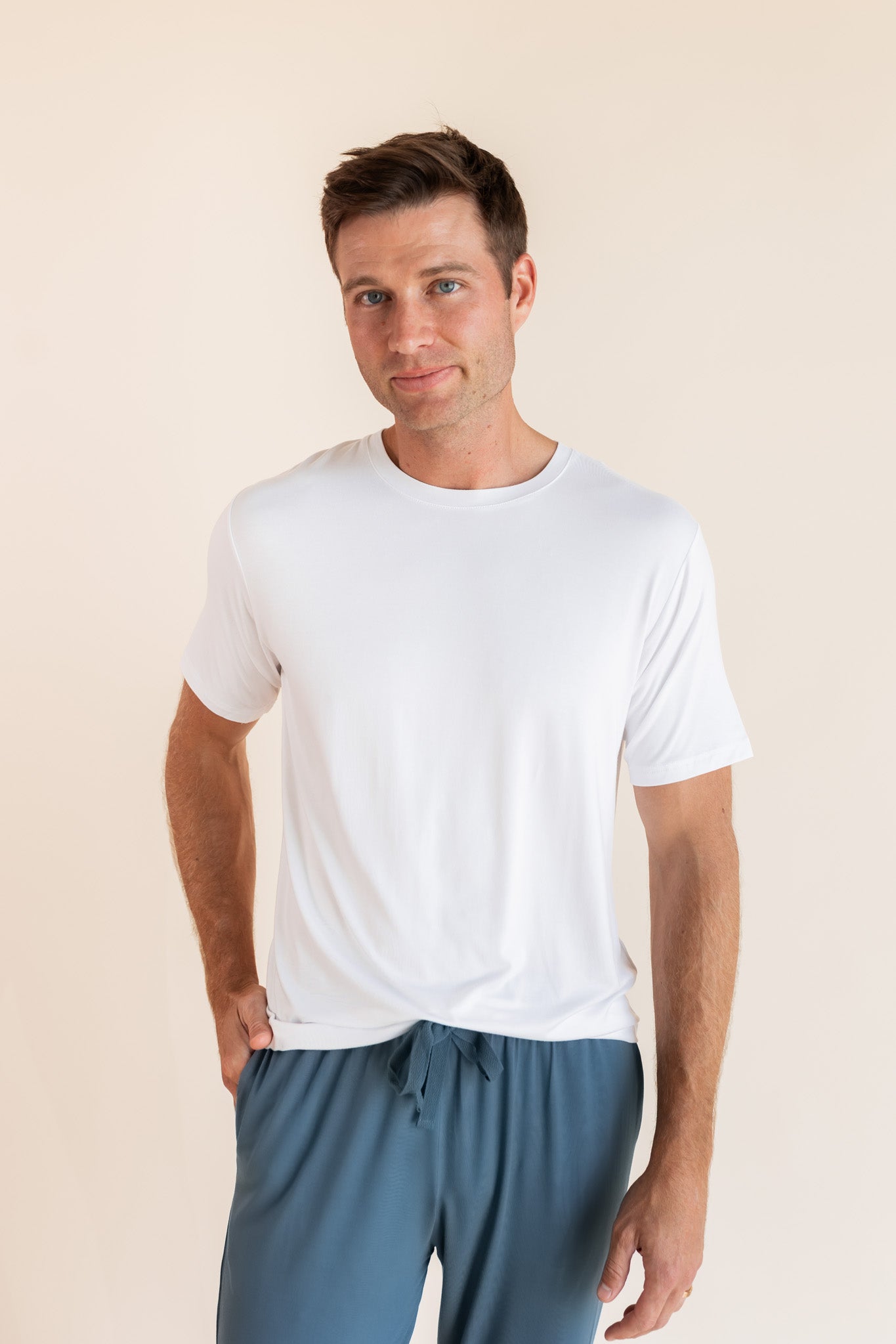 Man modeling Men's Crew Neck Tee in Snow with atlantic lounge pants on.