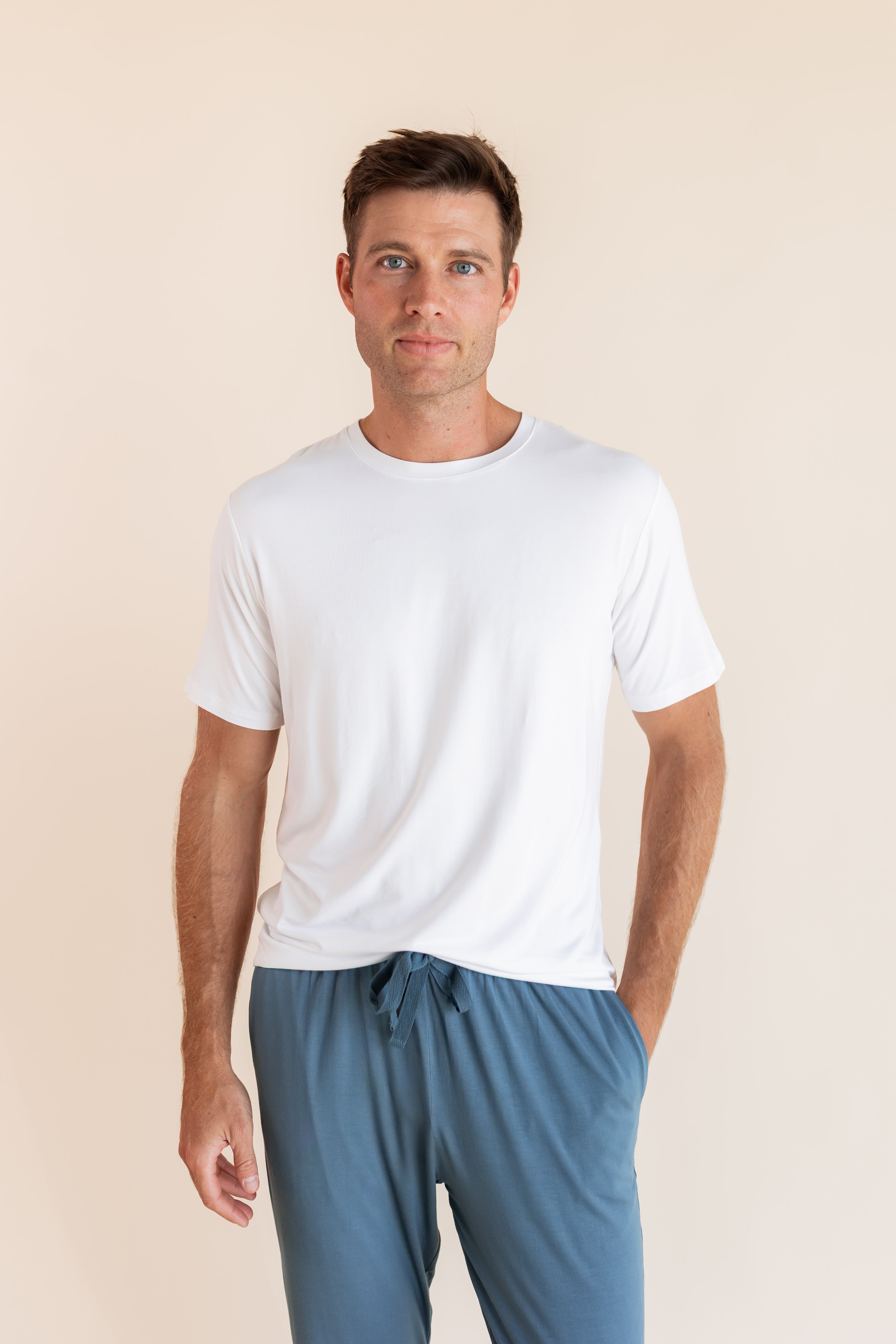 Man modeling Men's Crew Neck Tee in Snow with atlantic lounge pants on.