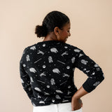 The back of the Women's Sweatshirt in STAR WARS™ shown on a model paired with white jeans