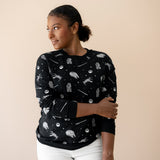 Female modeling the Women's Sweatshirt in STAR WARS™ paired with white jeans