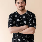 Male modeling the Men's Crew Neck Tee in STAR WARS™ with his arms crossed in front of him
