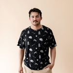 Male modeling the Men's Crew Neck Tee in STAR WARS™ paired with tan pants