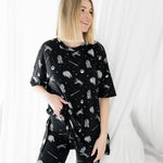 Female modeling the Women’s Biker Short Set in STAR WARS™ in front of a white background